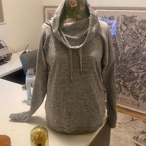 Grey pull string wide turtle pullover.